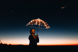 woman with lit-up umbrella